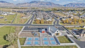 Aerial perspective of suburban area with a mountainous background