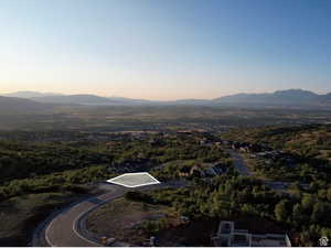 Aerial overview of property's location featuring mountains - approximate lot lines shown.