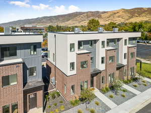 View of property with a mountain view