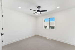 Unfurnished room with carpet flooring, recessed lighting, and ceiling fan