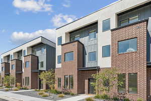 View of property with a residential view