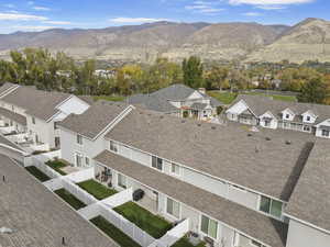 View of mountain backdrop featuring nearby suburban area