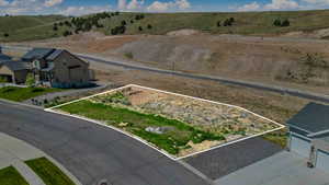 Aerial view of property and surrounding area featuring property parcel outlined