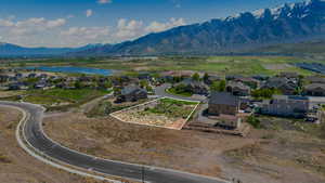 Aerial perspective of suburban area featuring a water and mountain view and property parcel outlined