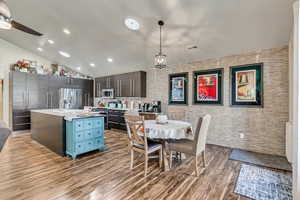 Enjoy your open concept dining with a full-wall glass backsplash and added skylights for abundant natural light