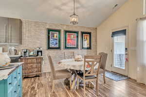 Enjoy your open concept dining with a full-wall glass backsplash and added skylights for abundant natural light