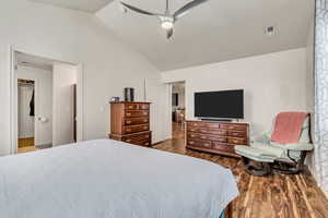 Spacious master bedroom with vaulted ceilings, laminate floors and abundant natural light