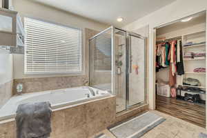 Spacious master suite with upgraded cabinets, separated shower/tub and a walk-in closet.