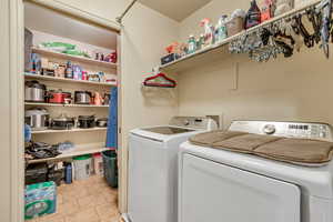 Pantry with washroom with washer and dryer