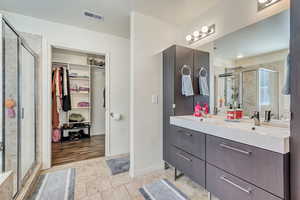 Spacious master suite with upgraded cabinets, separated shower/tub and a walk-in closet.