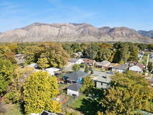 View of property location featuring nearby suburban area and mountains