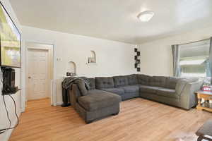 Living room with light wood-style floors