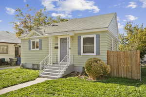Bungalow-style home featuring roof with shingles
