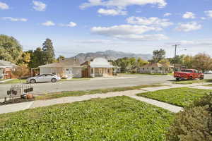 View of green lawn with a mountain view