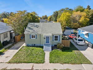 Bungalow-style house with a shingled roof