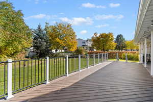 Deck with a yard and a residential view