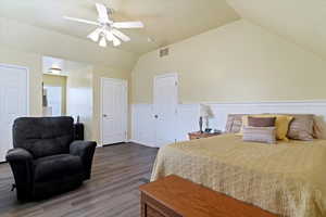 Bedroom featuring wood finished floors, lofted ceiling, and ceiling fan
