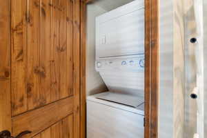 Washroom with stacked washing machine and dryer