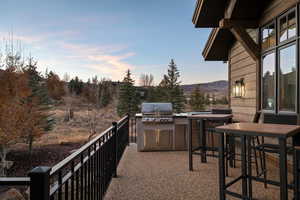 View of patio / terrace featuring exterior kitchen and a mountain view