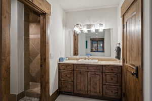 Bathroom with vanity and a stall shower