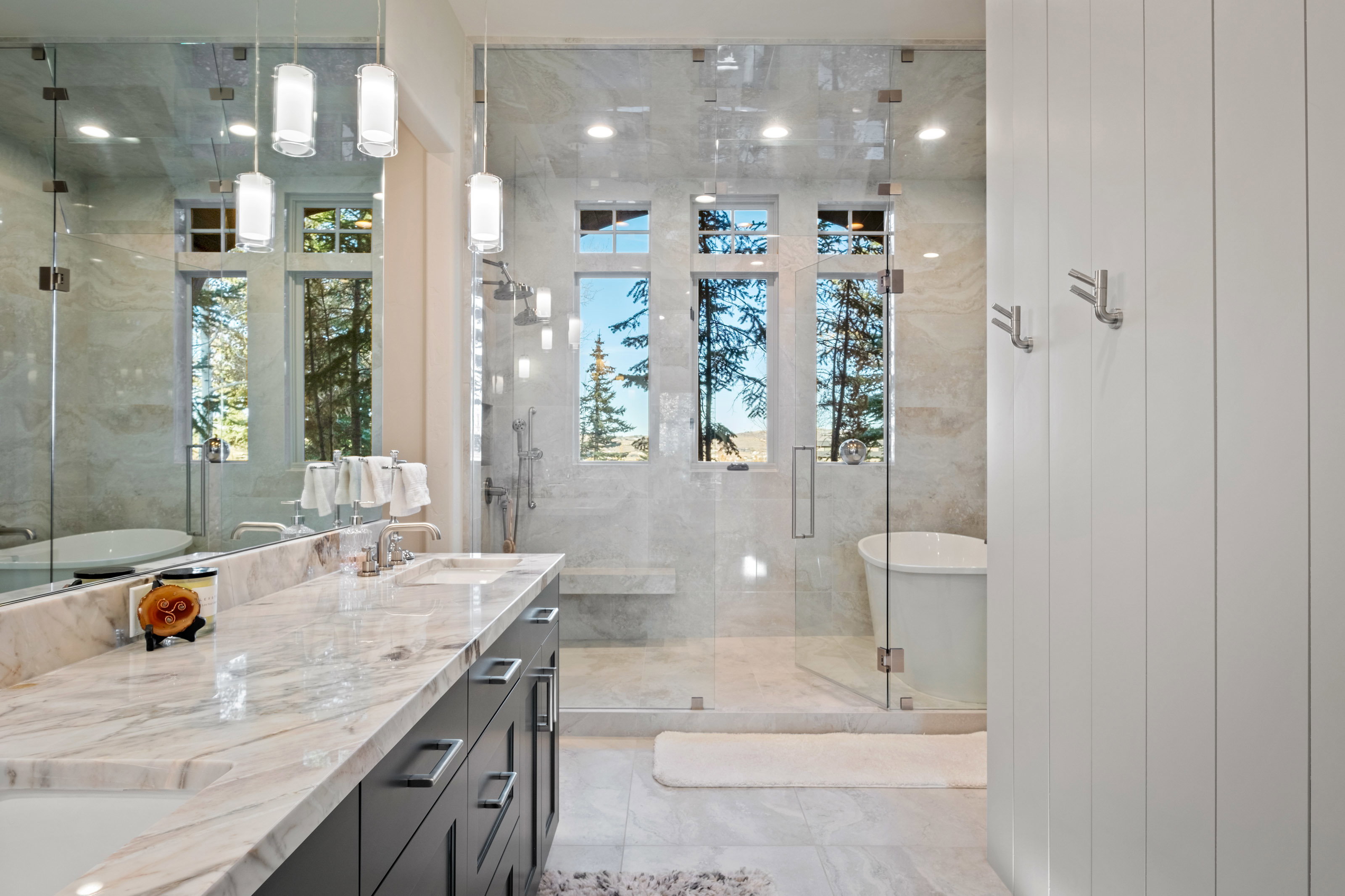 Full bath with a shower stall, a freestanding tub, and double vanity