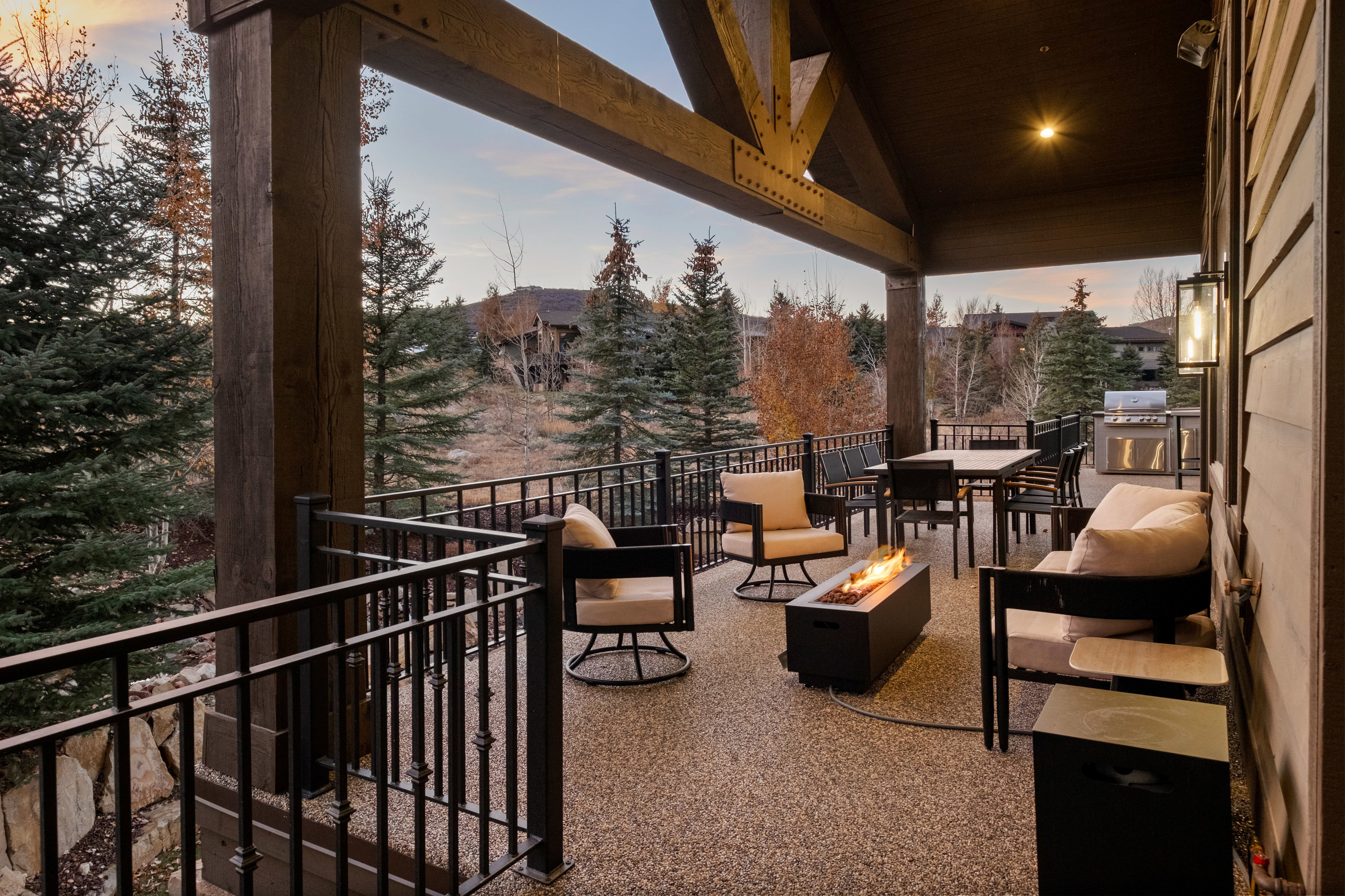 View of patio featuring an outdoor fire pit and an outdoor kitchen / dining area