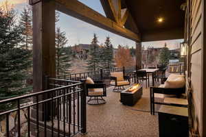 View of patio featuring an outdoor fire pit and an outdoor kitchen / dining area