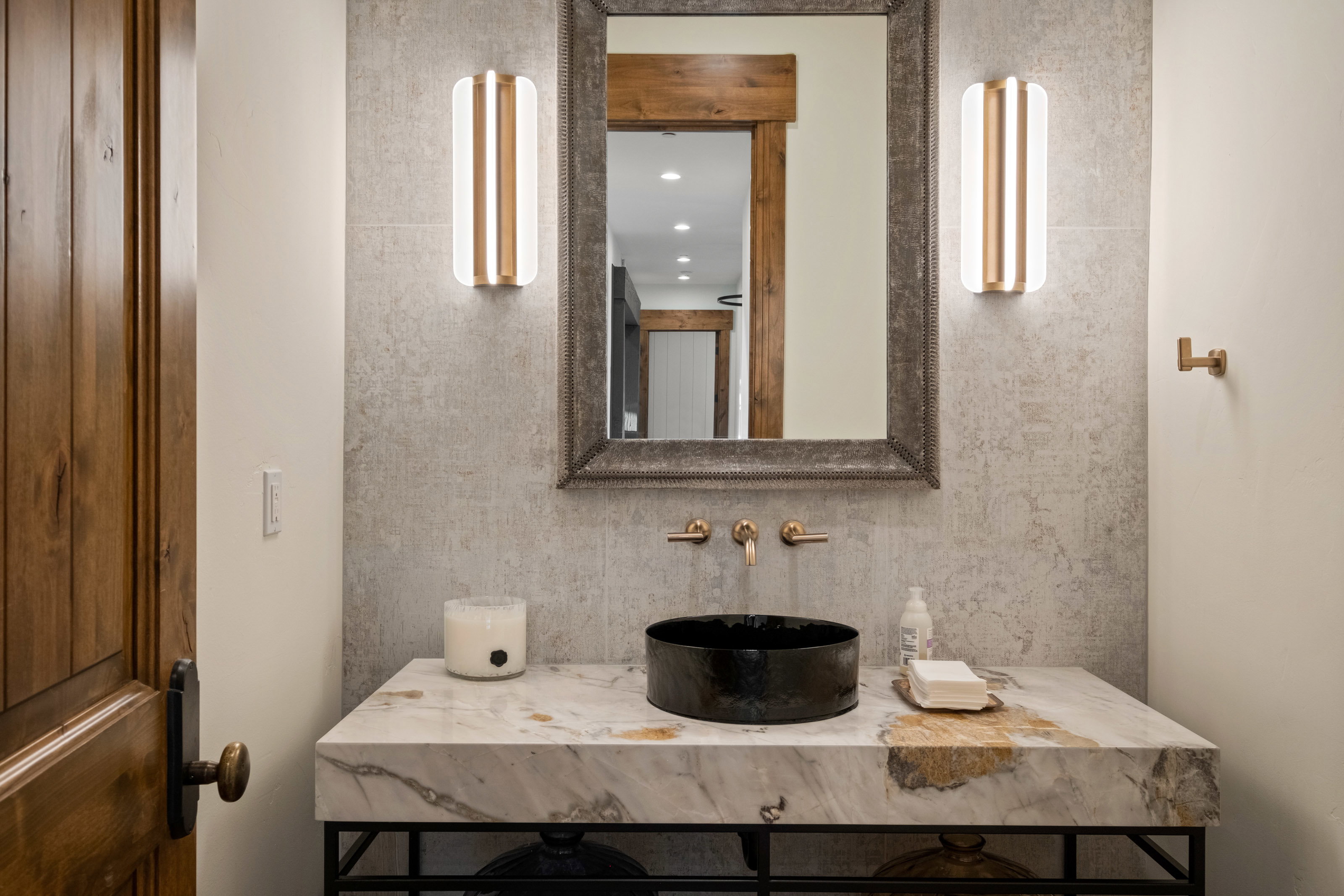 Bathroom featuring decorative backsplash and vanity