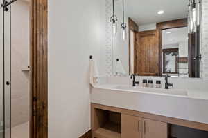 Bathroom featuring vanity and recessed lighting