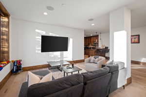 Living room featuring recessed lighting and light wood-style flooring