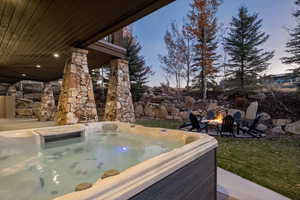 Exterior view of an outdoor fire pit and a jacuzzi