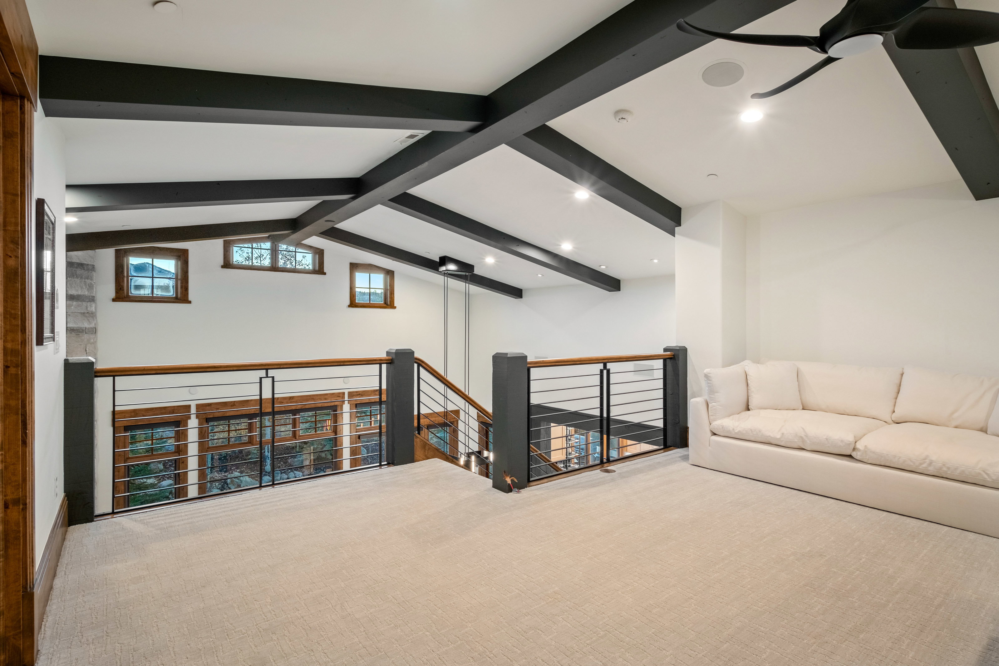 Bonus room featuring carpet, beamed ceiling, and recessed lighting