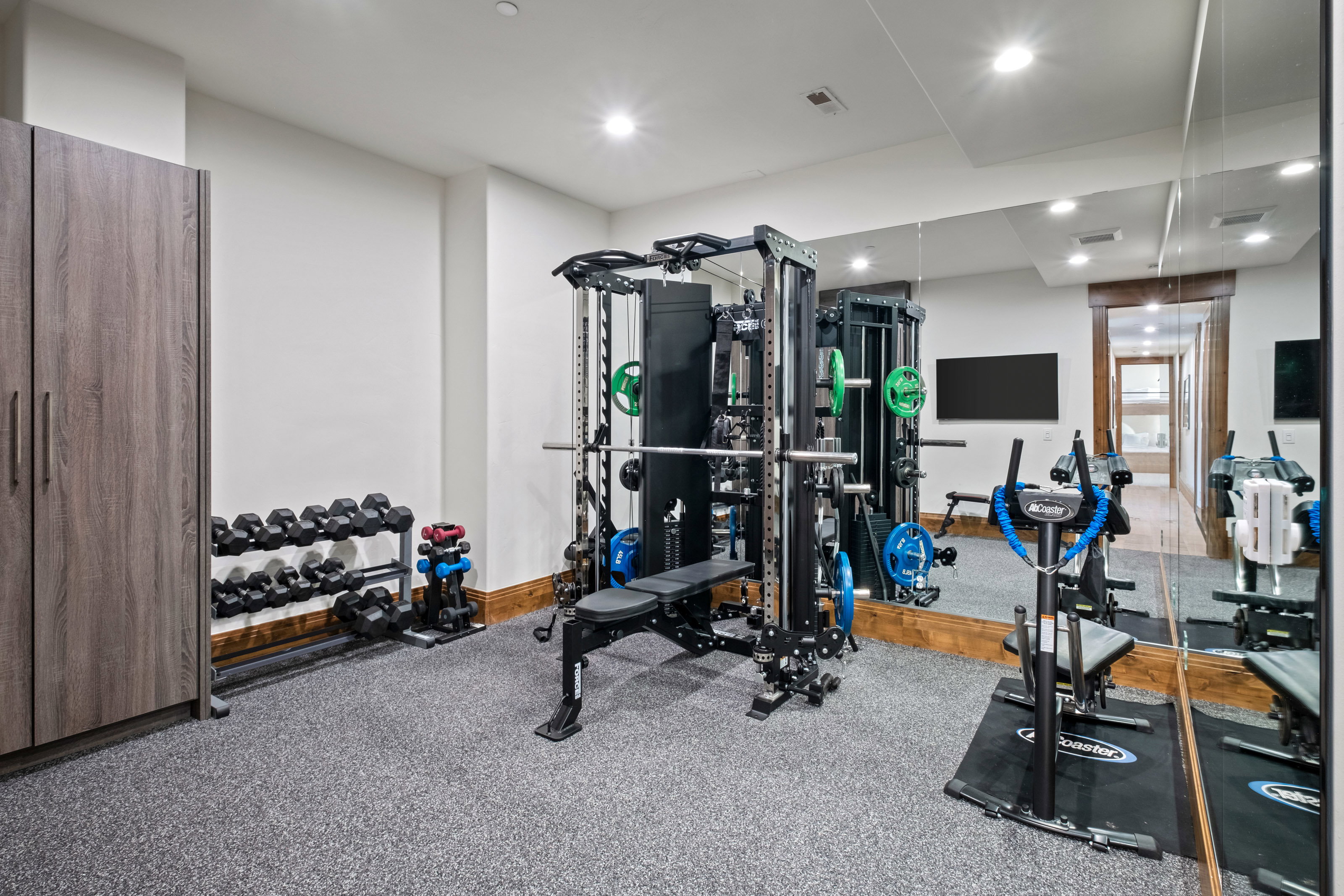 Exercise room featuring recessed lighting