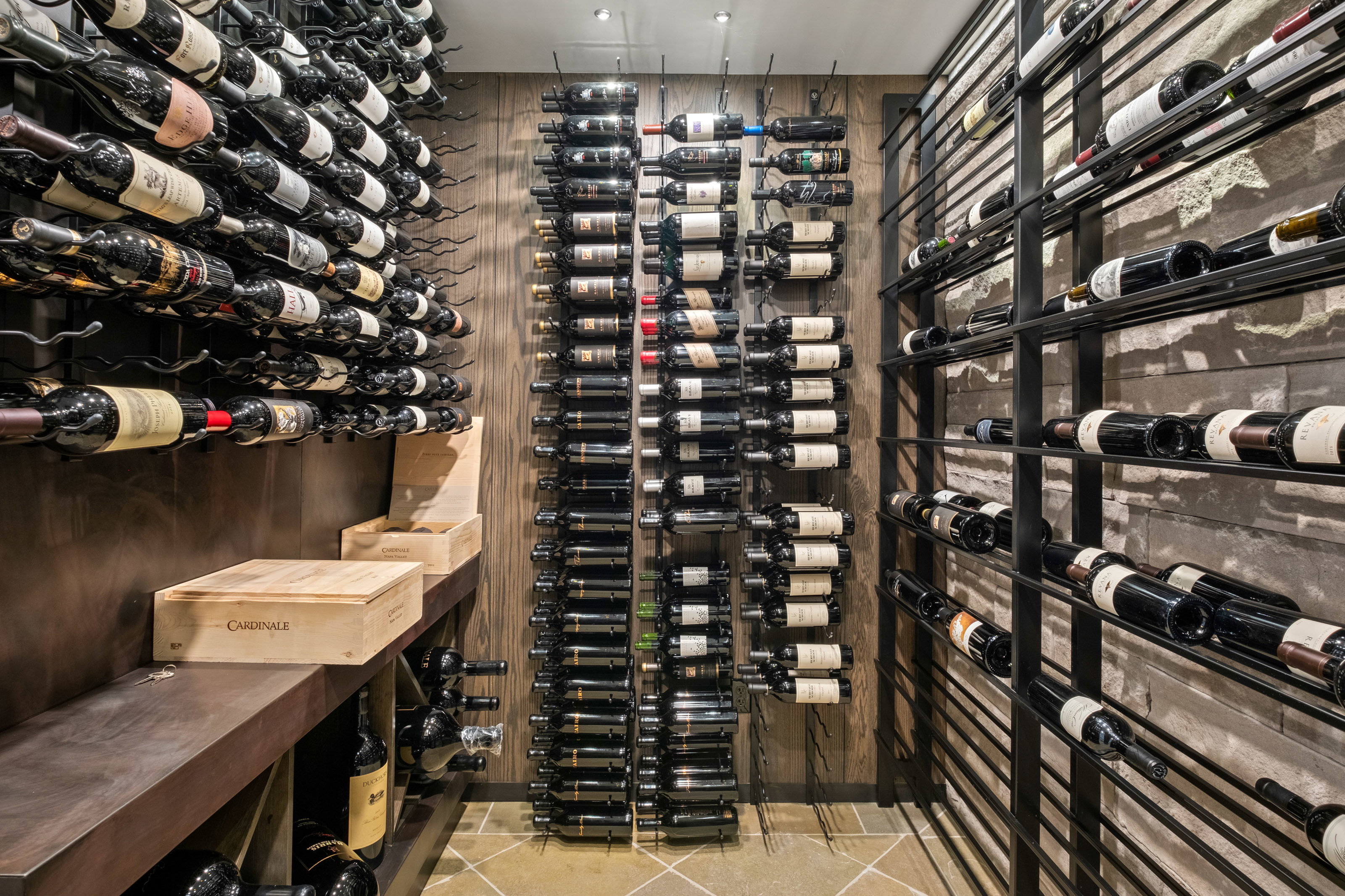 Wine cellar with light tile patterned floors