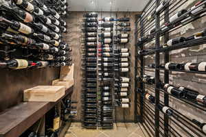 Wine cellar with light tile patterned floors