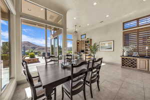 Dining area featuring recessed lighting, light tile patterned floors, plenty of natural light, and ceiling fan
