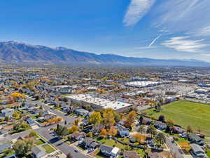 Aerial view of residential area featuring a mountainous background