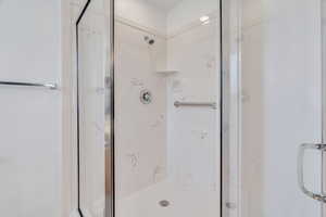 Bathroom with a marble finish shower
