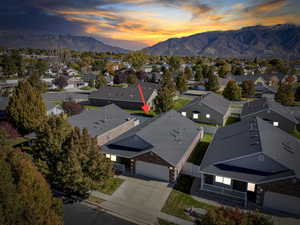 Aerial view of residential area with a mountainous background