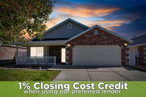 View of front of home featuring an attached garage, brick siding, concrete driveway, and a porch