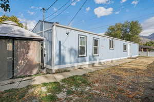 View of side of property with a mountain view