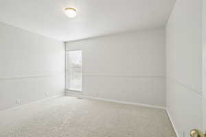 Spare room with carpet flooring and baseboards