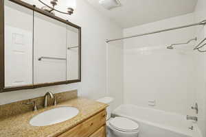 Bathroom with vanity and tub / shower combination