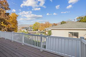 Deck featuring a residential view and a mountain view