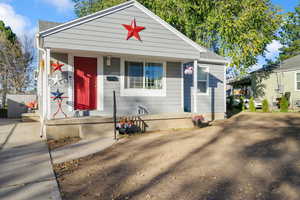 Bungalow with a porch and a shingled roof