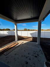 Fenced backyard with a patio