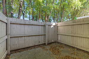 Fenced backyard with a gate