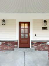 Entrance to property with covered porch