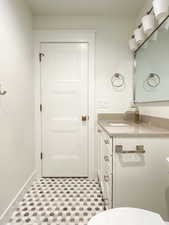 Bathroom featuring vanity and toilet