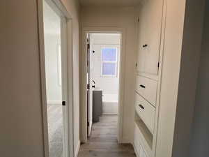 Hall with light wood-type flooring